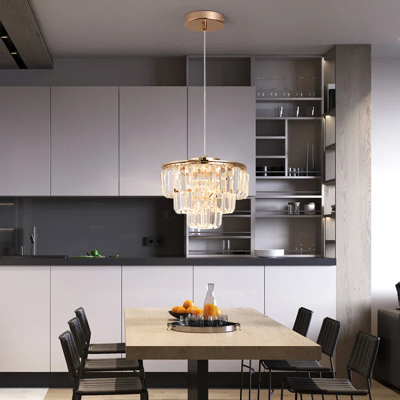 Elegant crystal LED chandelier with multiple light crystals, modern design by TheChandelierCo, hanging from a sleek metal frame.