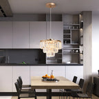 Elegant crystal LED chandelier with multiple light crystals, modern design by TheChandelierCo, hanging from a sleek metal frame.