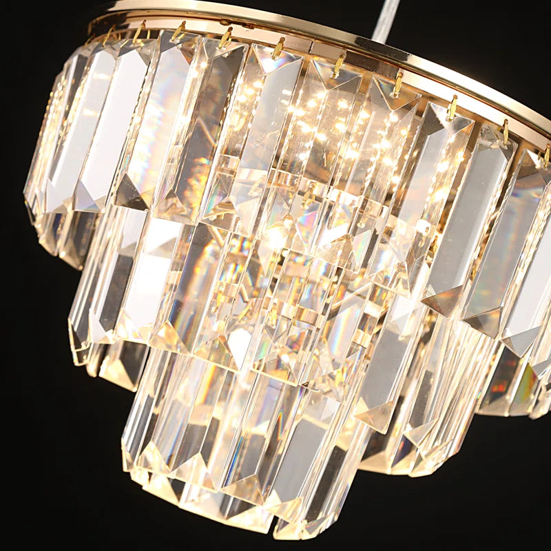 Elegant crystal LED chandelier by TheChandelierCo featuring multiple hanging light crystals and a sleek modern design.