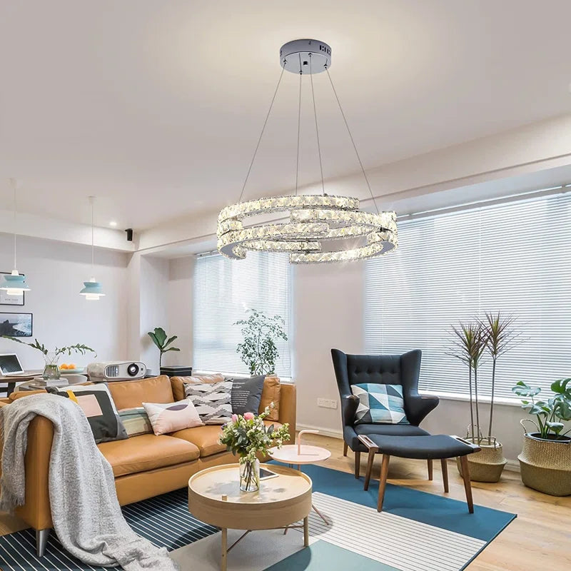 Three-light unique LED chandelier by TheChandelierCo featuring modern, statement-design with sleek metal finish and illuminated glass accents.