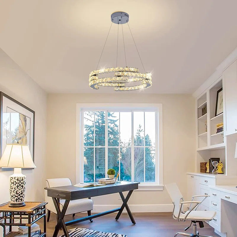 Three-light unique LED chandelier by TheChandelierCo with modern, artistic design featuring sleek, illuminated statement fixtures.