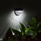 Set of two 4.5cm high solar-powered LED outdoor bulkhead lights by TheChandelierCo, weather-resistant with integrated lighting.
