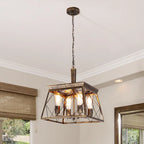 Four light bronze lantern pendant lights with intricate metal detailing, hanging together for a stylish lighting fixture.