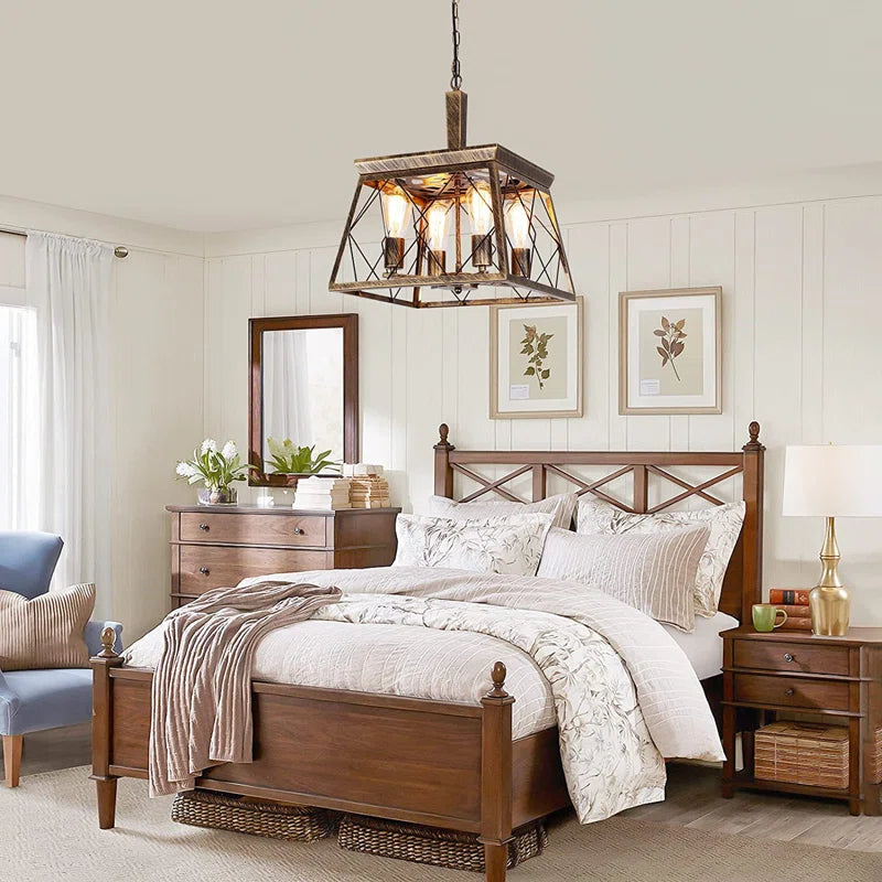 Four light bronze lantern pendant lights by TheChandelierCo with intricate metal framework and warm finish, hanging from ceiling.