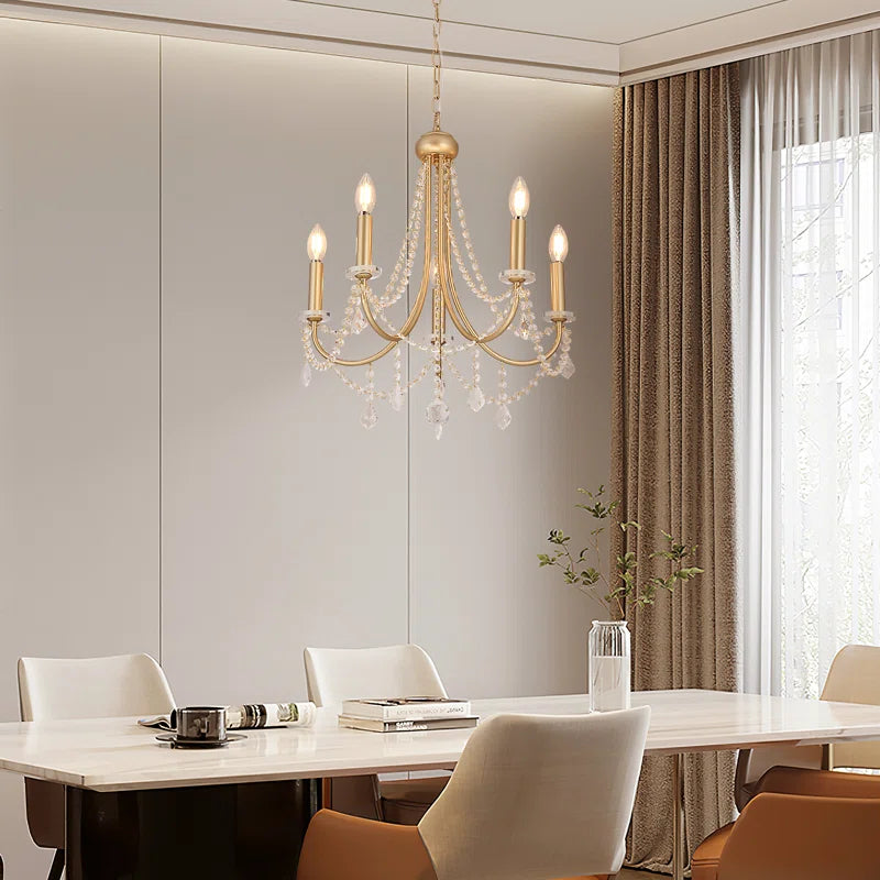 Five-light candle-style chandelier from TheChandelierCo featuring classic candle-shaped bulbs and elegant metal frame.