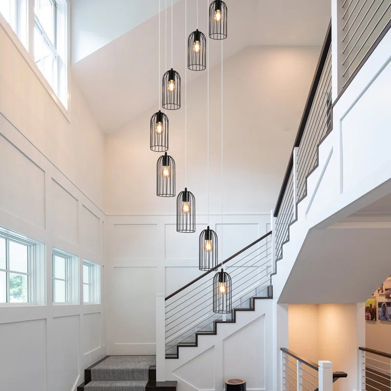 Eight-light cluster chandelier by TheChandelierCo featuring modern design with multiple hanging light bulbs and sleek metal finish.