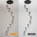 Eight-light cluster chandelier by TheChandelierCo featuring modern design with multiple hanging light fixtures and sleek metal finish.