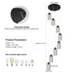 Eight-light cluster chandelier by TheChandelierCo with modern glass shades hanging from a sleek metal frame.