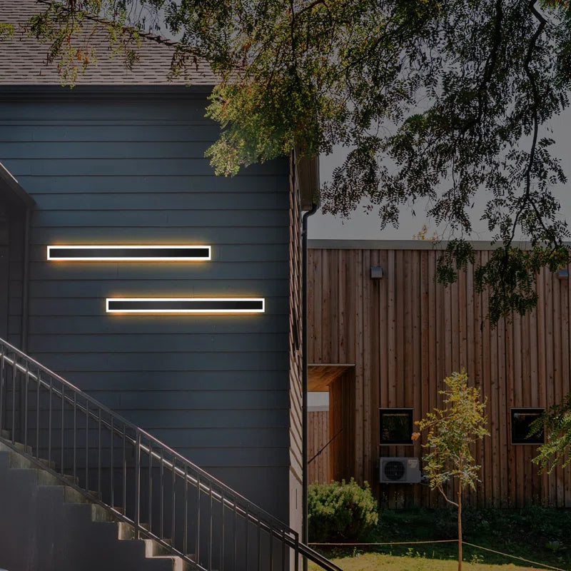 Aarti black outdoor cellar light by TheChandelierCo, showcasing a modern black metal fixture with glass panels for outdoor illumination.