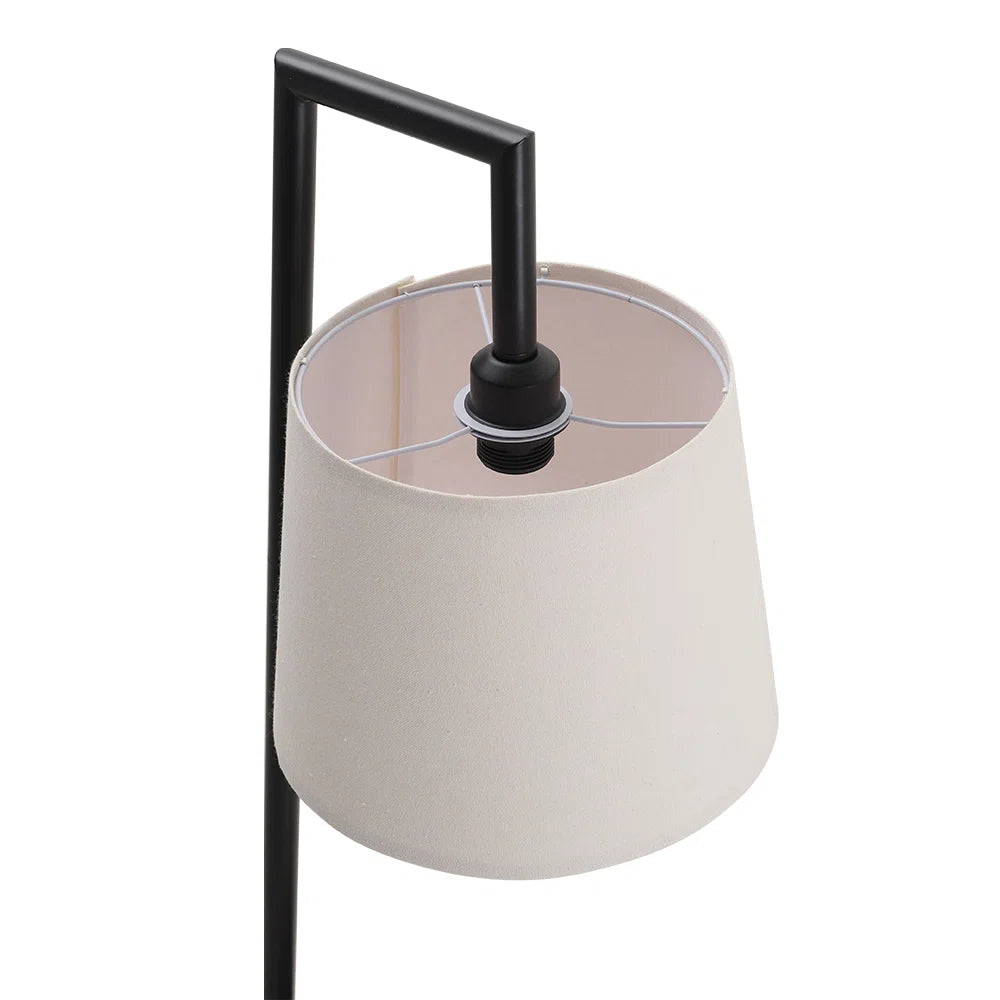 Abhirami 150cm black metal tray table floor lamp with linen lampshade, featuring a modern design and sturdy metal base.