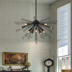 Akzel 10 light pendant by TheChandelierCo featuring a modern design with a sleek metal finish and 10 hanging light bulbs.