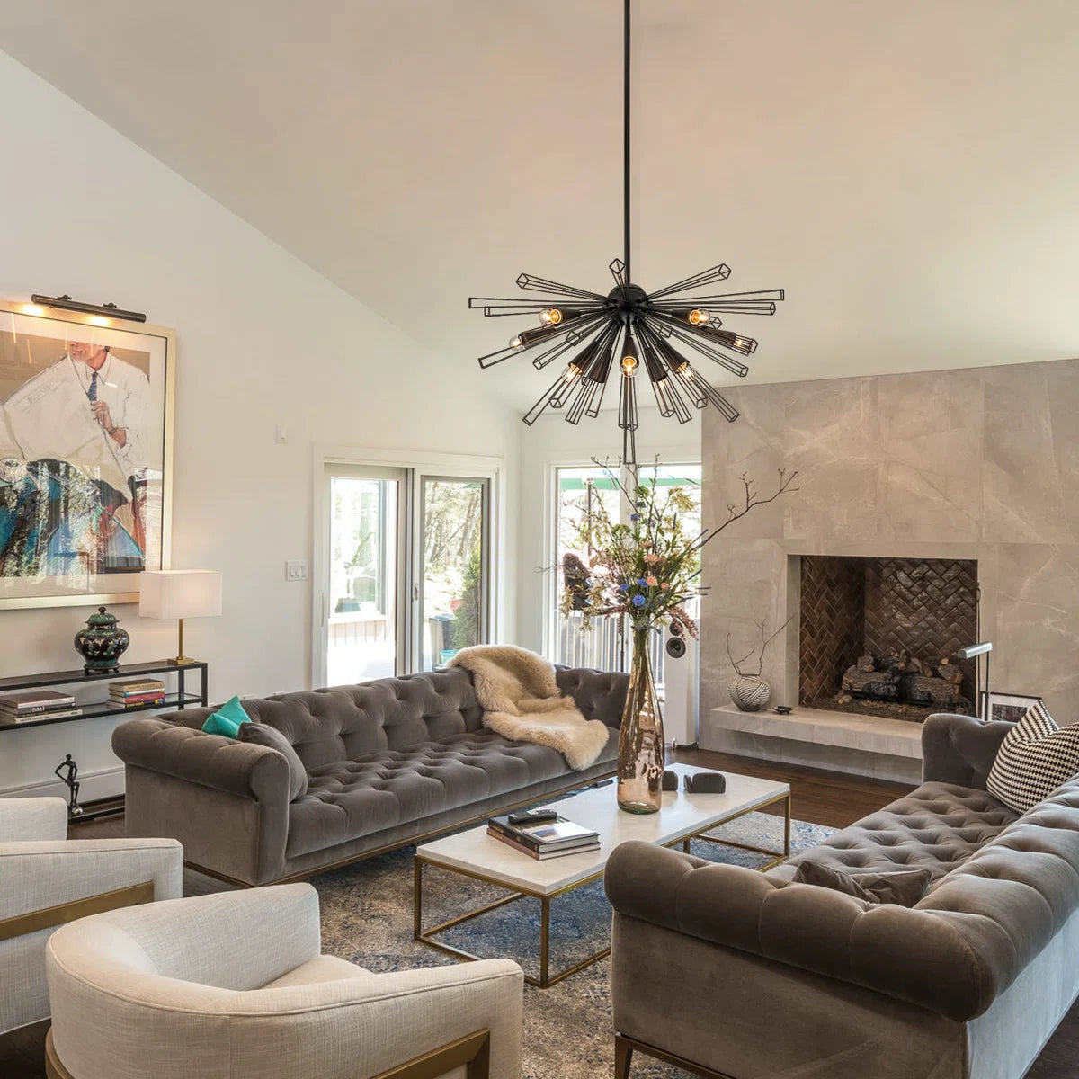 Modern Akzel 10 light pendant by TheChandelierCo featuring sleek design with ten hanging bulbs and a stylish metal frame.