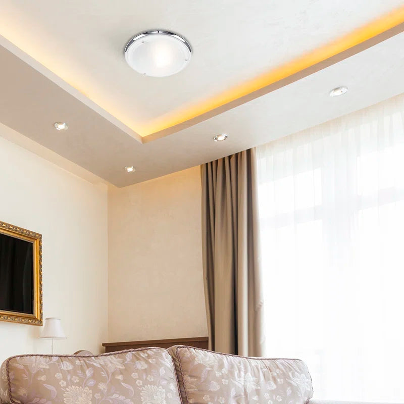 Altieri glass flush mount ceiling light fixture with clear glass shade and modern design, perfect for contemporary interiors.