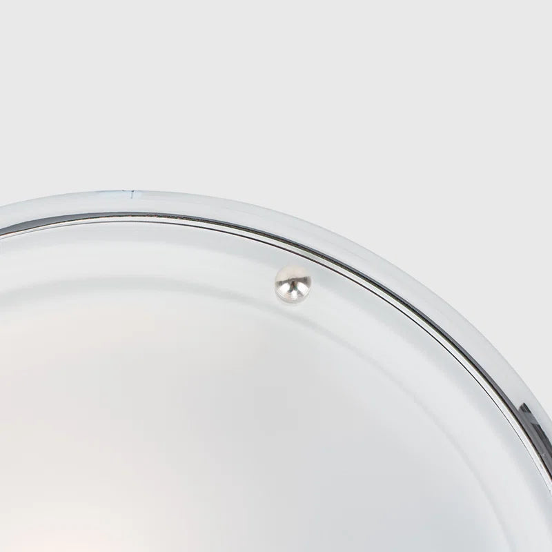 Altieri glass flush mount ceiling light fixture with clear glass shade and metallic finish, designed for elegant interior lighting.