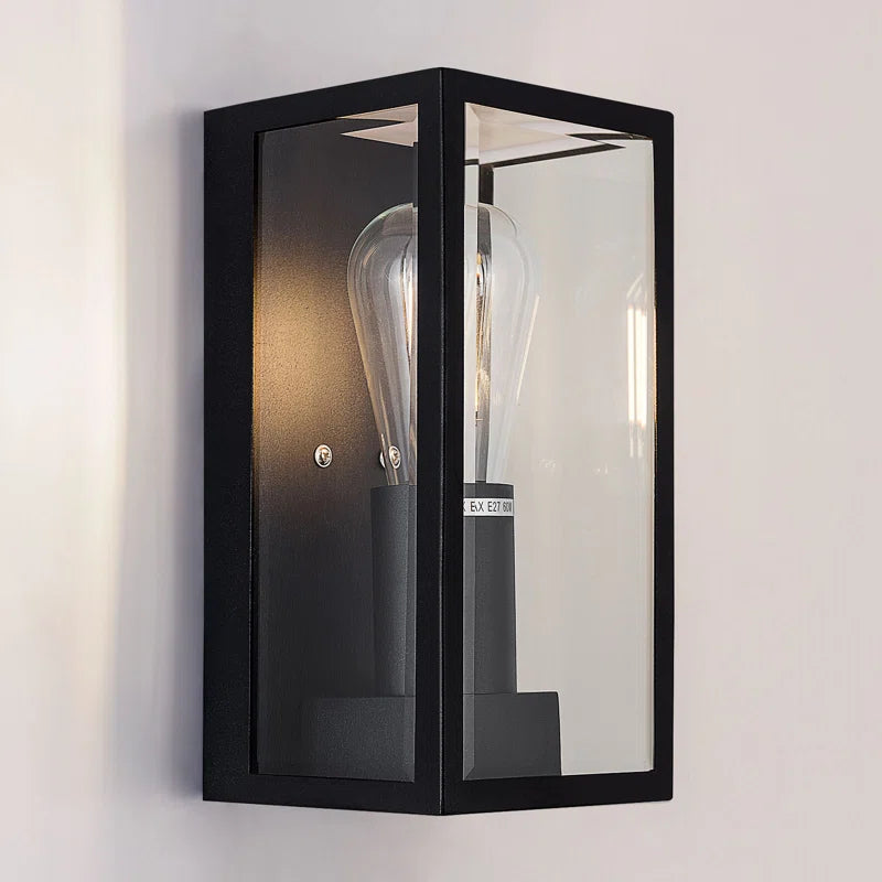 Black Amandla outdoor flush mount light fixture by TheChandelierCo, 23.5cm tall, with a sleek modern design for exterior lighting.