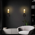Set of two Ambellina iron armed sconces with curved arms and candle-style light holders, modern wall lighting by TheChandelierCo.