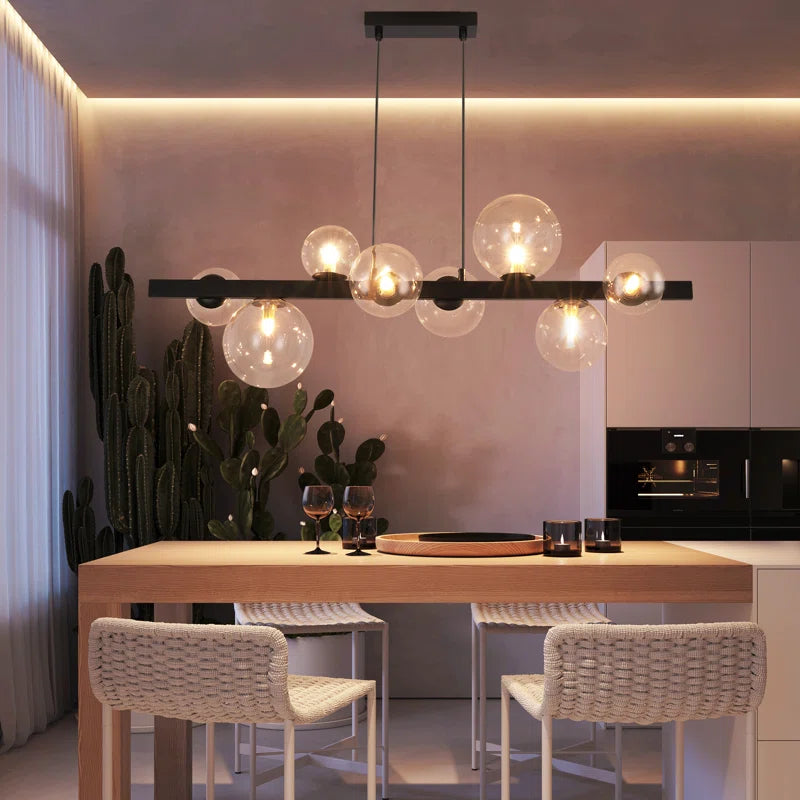 Light matte black sphere pendant light from the Ammanda 8 collection by TheChandelierCo, showcasing a modern, minimalist fixture.