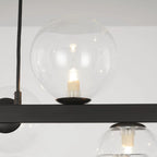 Light matte black sphere pendant light from the Ammanda 8 collection by TheChandelierCo, featuring a sleek modern design.