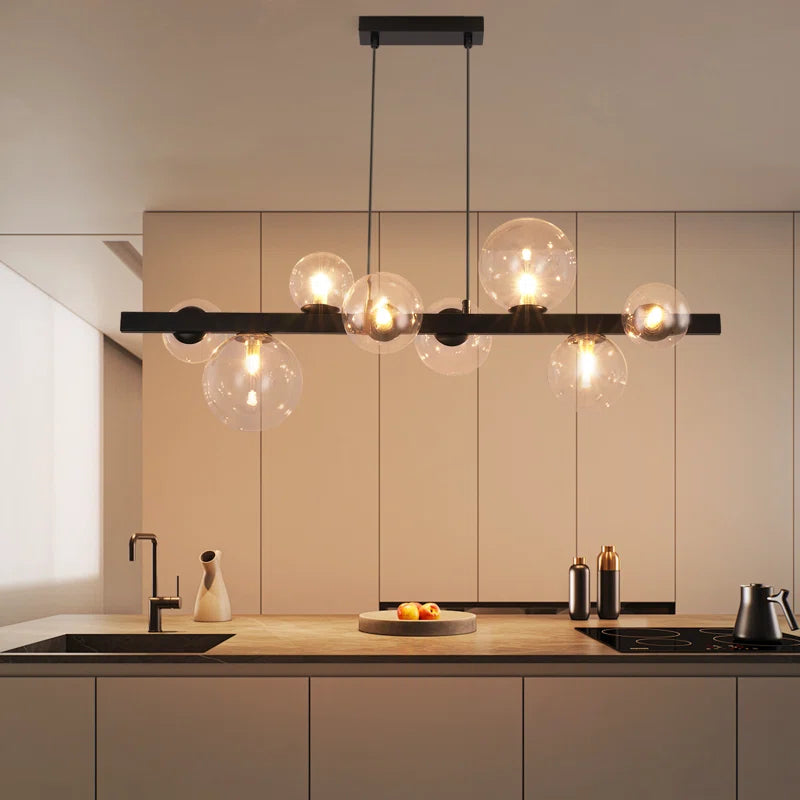 Light matte black sphere pendant light from Ammanda 8 by TheChandelierCo, hanging with a sleek, modern design.