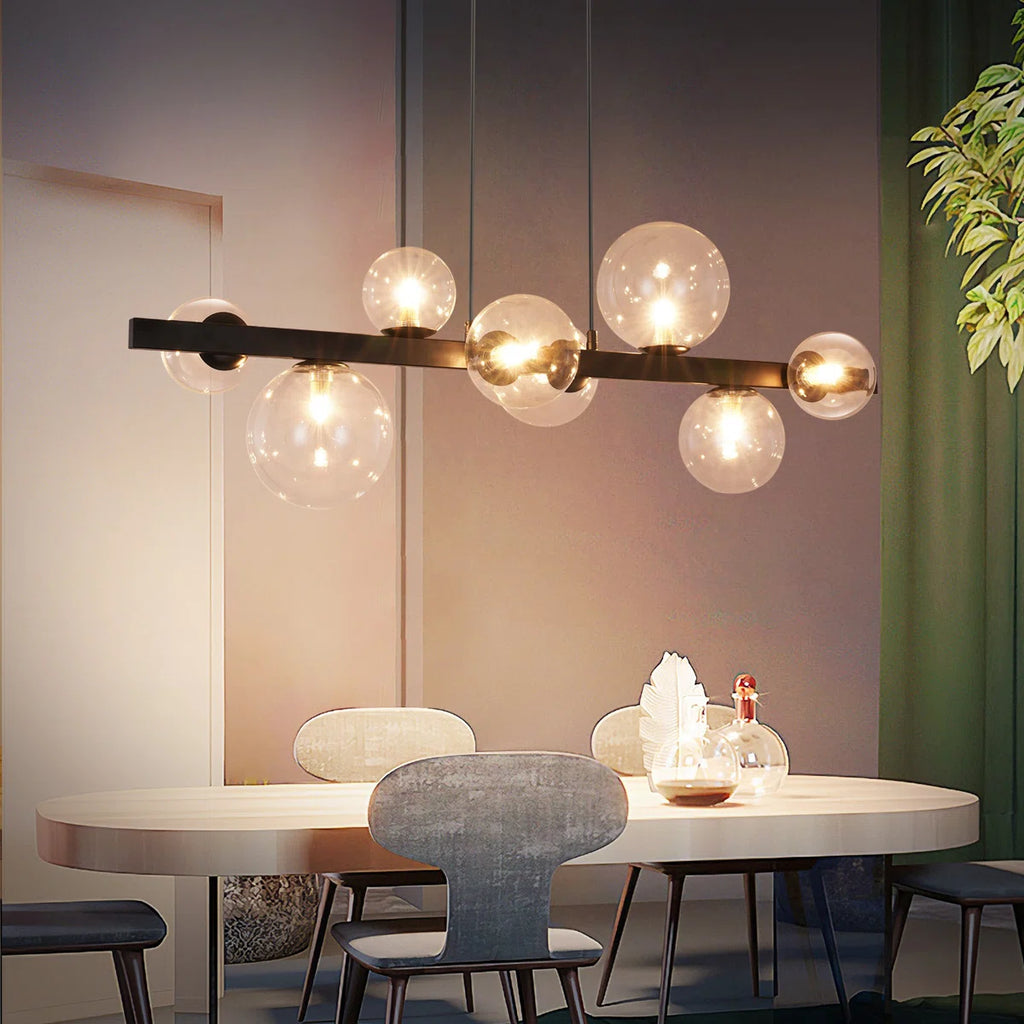 Light matte black sphere pendant from the Ammanda 8 collection by TheChandelierCo, hanging as a modern ceiling light fixture.