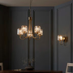Steel and glass armed sconce by TheChandelierCo featuring a modern design with a sleek metal arm and clear glass shade.
