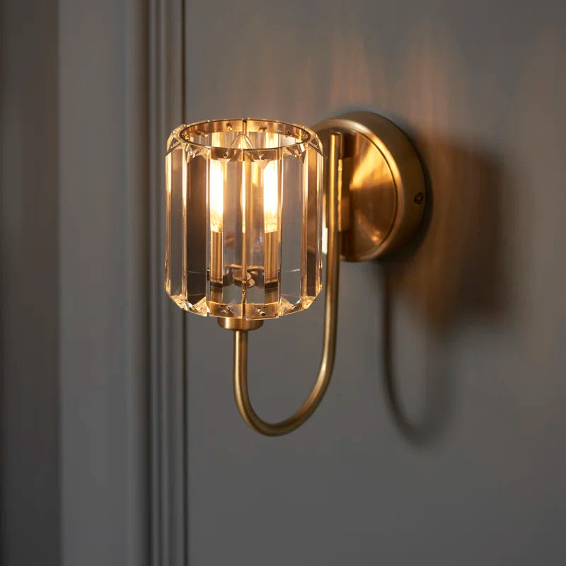 Steel and glass armed sconce by TheChandelierCo featuring a modern design with exposed bulbs and sleek metal armature.