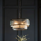 Anesty 5-light pendant chandelier by TheChandelierCo with antique brass finish, featuring five elegant hanging lights and a modern design.