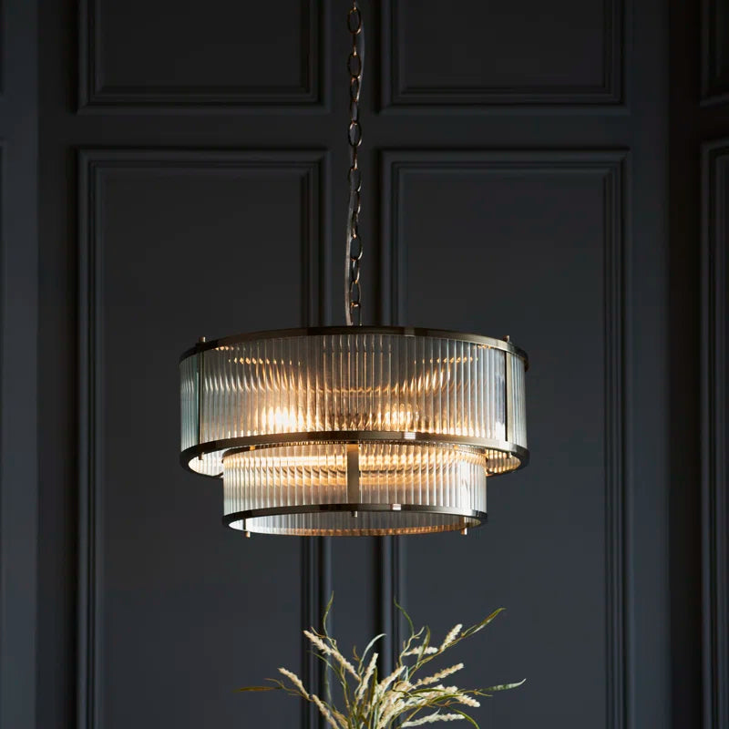 Anesty 5-light pendant chandelier by TheChandelierCo with antique brass finish, featuring five elegant hanging lights and a modern design.