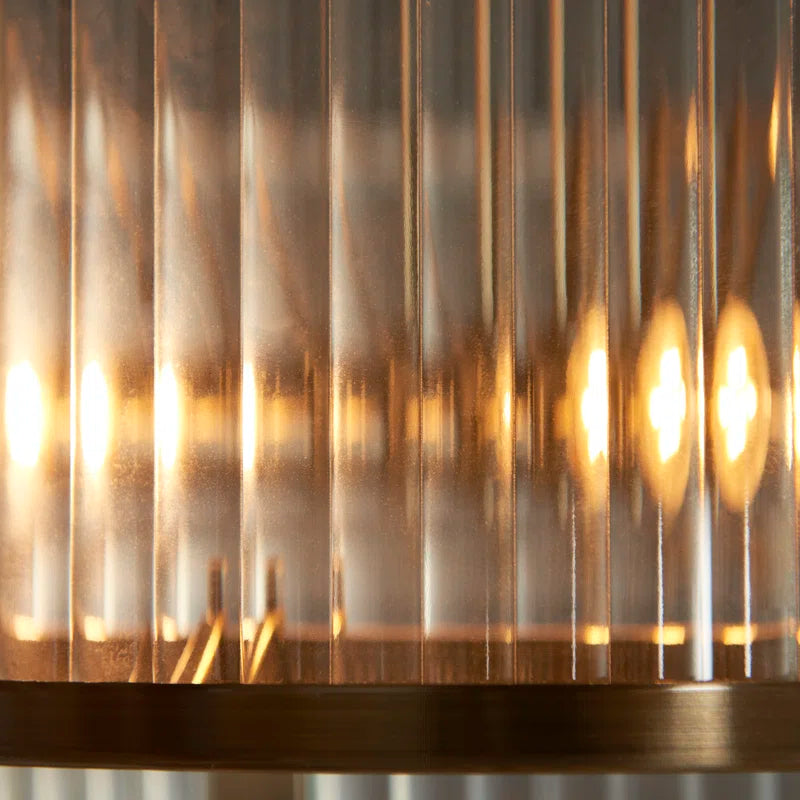 Anesty 5-liter pendant light by TheChandelierCo with antique brass finish, featuring a sleek modern design and multiple hanging lights.