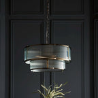Anesty 5-liter pendant light by TheChandelierCo with antique brass finish, hanging with exposed bulbs and a modern industrial design.