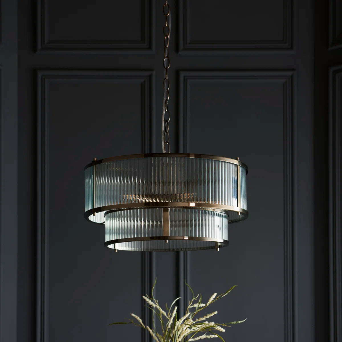 Anesty 5-liter pendant light by TheChandelierCo with antique brass finish, hanging with exposed bulbs and a modern industrial design.