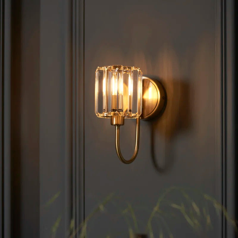 Antique brass plate for Ampelius steel and glass armed sconce by TheChandelierCo, showcasing elegant vintage lighting details