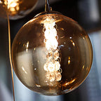 Ariya 4 Light Schwarz Unique Statement Pendant by TheChandelierCo, featuring a modern black pendant with artistic design.