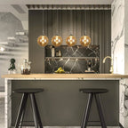 Ariya 4 Light Schwarz unique statement pendant light by TheChandelierCo hanging with black modern design and sleek curves.