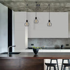 Elegant Barner 3 light chandelier by TheChandelierCo featuring a modern design with multiple hanging light fixtures.