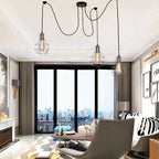 Elegant Barner 3 light chandelier by TheChandelierCo featuring a modern design with glass and metal accents.