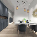 Elegant Barner 3 light chandelier by TheChandelierCo with multiple glass shades and modern design for stylish interior lighting.