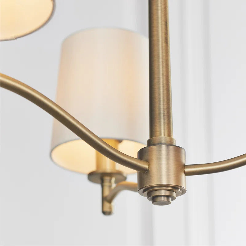 Beaumont 3 light shaded chandelier by TheChandelierCo hanging from ceiling with three light fixtures and elegant light shades.