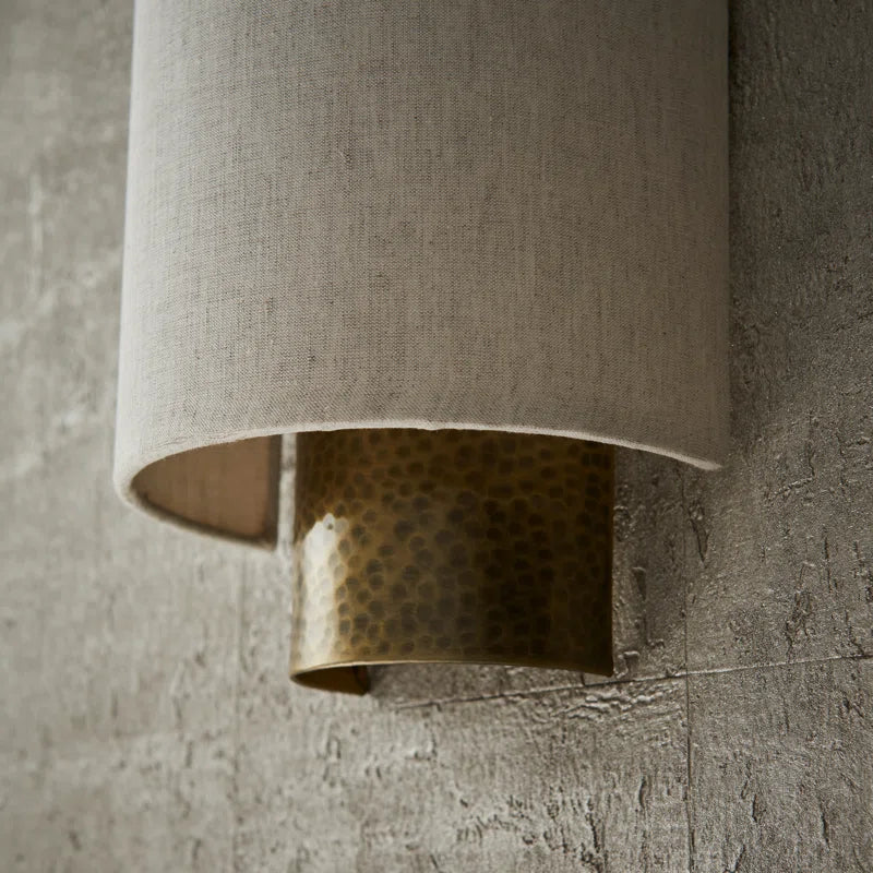 Set of two Beedle flush mounted wall sconces by TheChandelierCo with sleek, modern design and warm lighting.