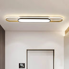 Black and gold Muscato 1-light 110cm LED flush mount ceiling light by TheChandelierCo showing sleek, modern design.