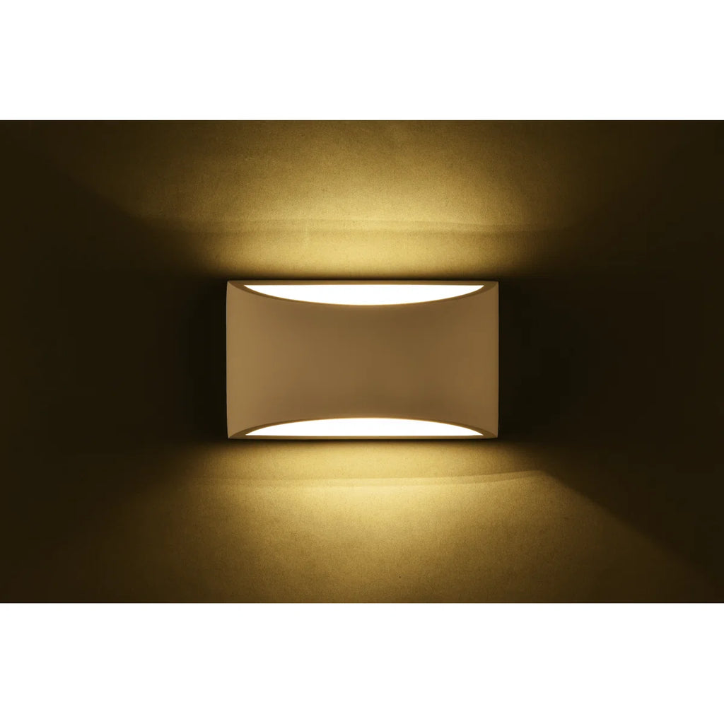 Blandford flush mounted sconce by TheChandelierCo, featuring a sleek design with a polished metal finish and glass shade.