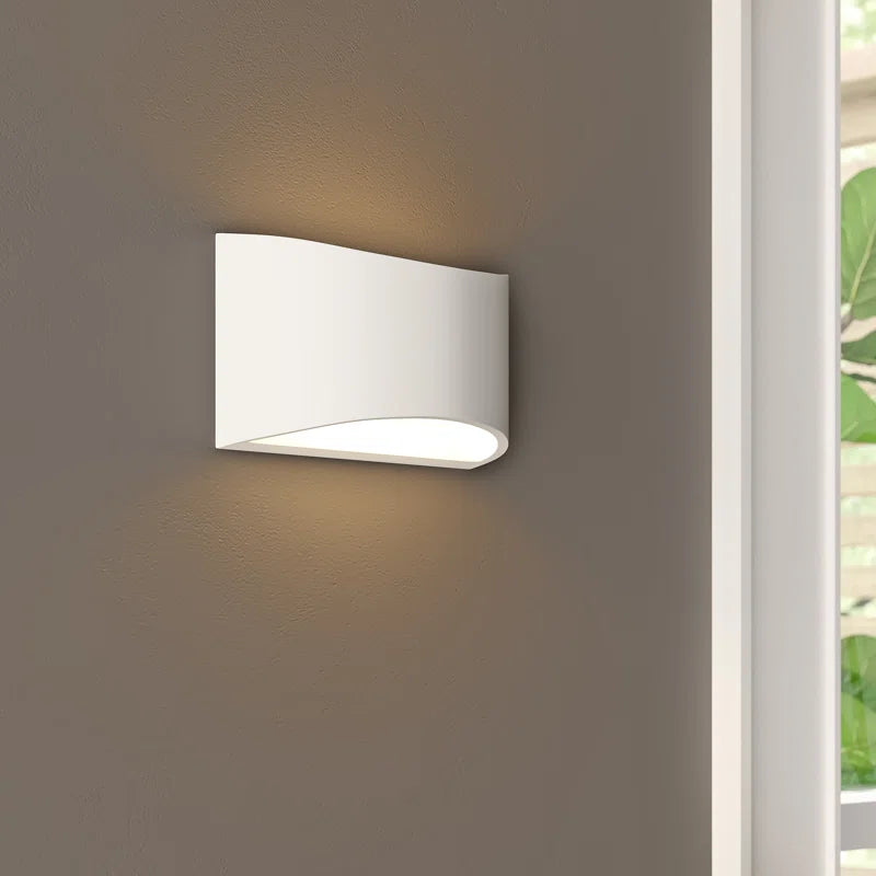 Elegant Blandford flush mounted sconce by TheChandelierCo featuring a sleek design with a metal finish and soft lighting.