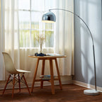 Bonita Arquer 66.93-inch arc floor lamp by TheChandelierCo with faux black marble base and black bell shade.