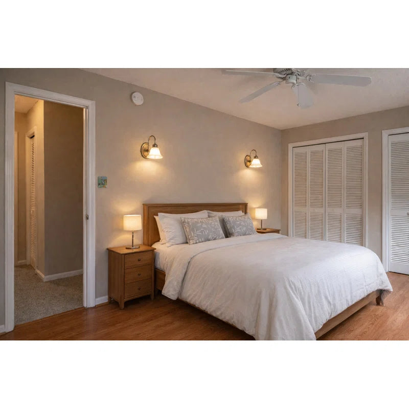 Brazell 1-light dimmable antique brass sconce with alabaster-style glass shade, featuring an arm design for wall lighting.