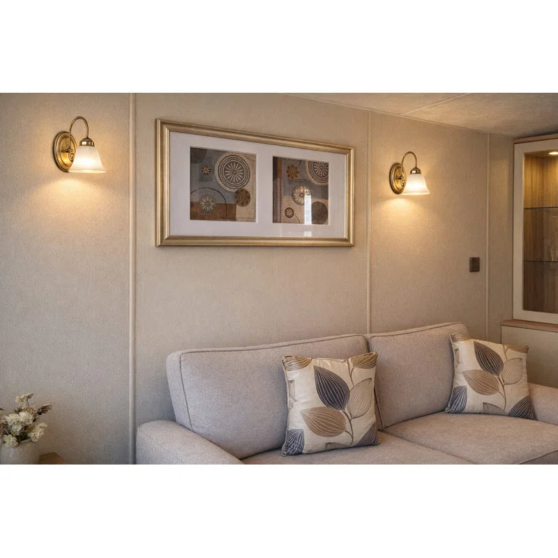 Brazell 1-light dimmable antique brass armed sconce with alabaster-style glass shade, wall-mounted lighting fixture.