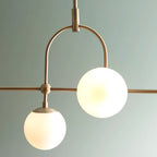 Cadel Impressive 5-light antique brass linear chandelier with modern design, featuring sleek metal finish and elegant light fixtures.
