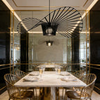 Light black Carlose 1 pendant light by TheChandelierCo featuring an artistic ribbed design and decorative frame.