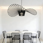 Light black Carlose 1 pendant light by TheChandelierCo featuring an artistic ribbed design and decorative frame.