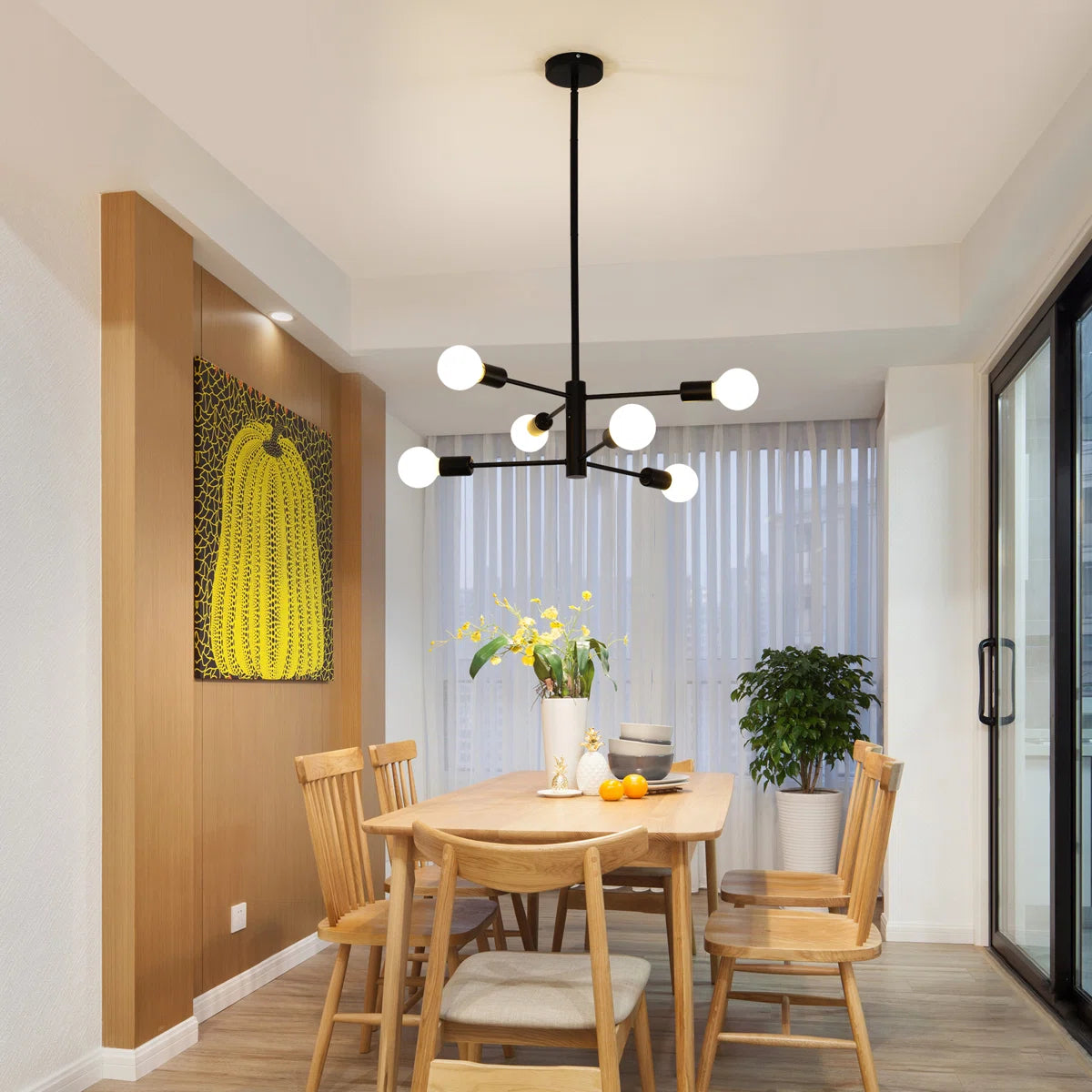 Cobina 6 light Sputnik chandelier by TheChandelierCo featuring a modern gold finish and six exposed bulbs on a spherical frame.