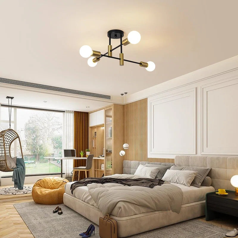 Coblitz 4 Light Sputnik Chandelier by TheChandelierCo featuring a modern metal frame with four exposed bulbs in a spherical design.